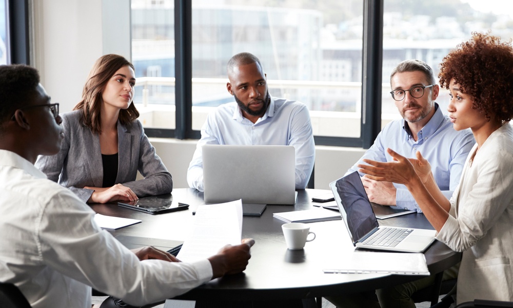 Millennial Black Businesswoman Addressing Colleagues At A Corporate Business Meeting, Close Up