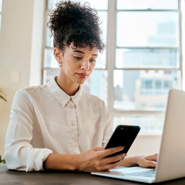 Corporate Communicator looking at mobile